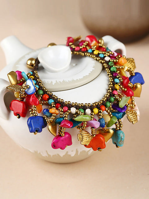 Pulsera turquesa tejida con elefante bohemio para mujer