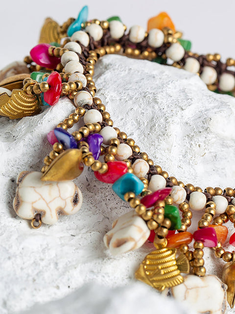 Pulsera turquesa tejida con elefante bohemio para mujer