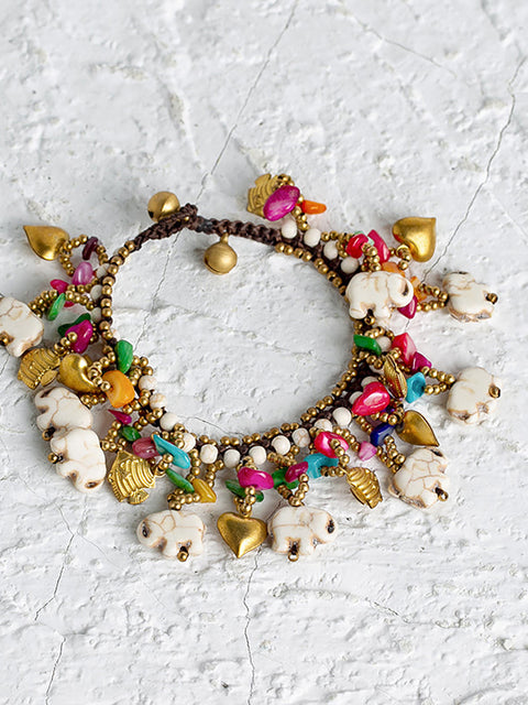 Pulsera turquesa tejida con elefante bohemio para mujer